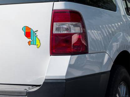 Autocollant en papier de l'île de la Martinique avec motif madras "Soleil couchant" sur le dos d'un camion blanc, produit Prodigi.