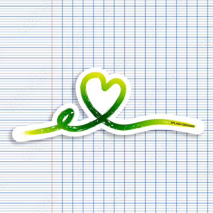 Autocollant cœur tracé rose de la marque Prodigi, avec un design en ligne verte, visible sur la photo.
