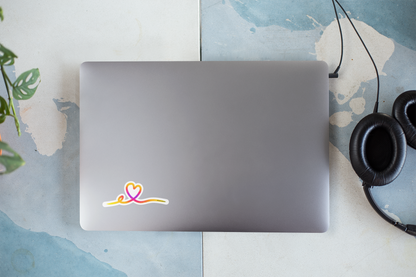 Autocollant Prodigi cœur tracé en rose sur un ordinateur portable, design élégant et coloré pour décoration.