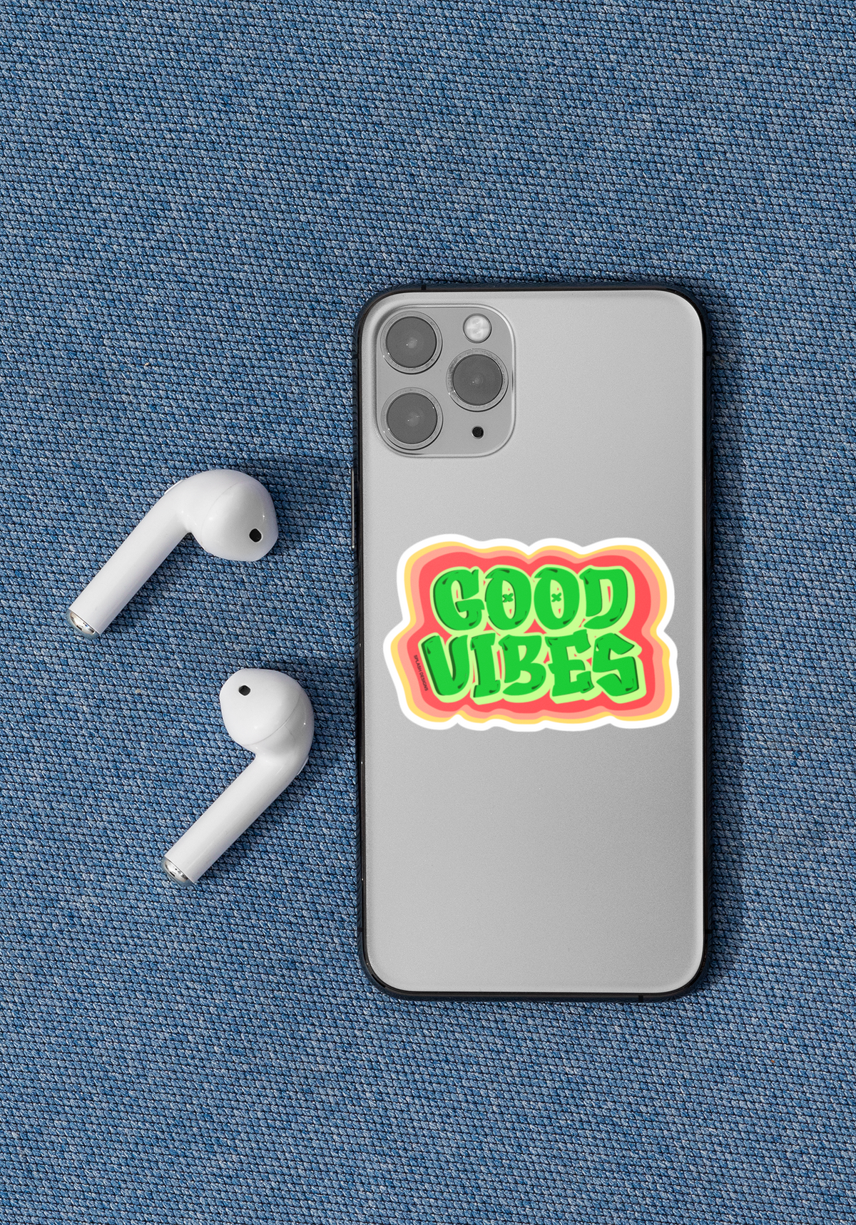 Autocollant "Good Vibes" de Prodigi appliqué sur un iPhone 11 Pro, affichant un design coloré et positif.