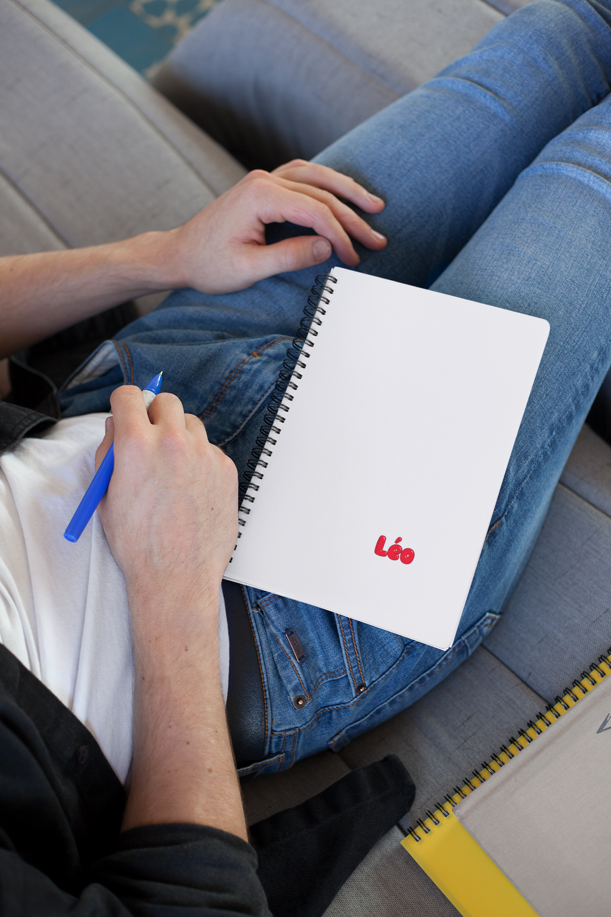 Autocollant personnalisé avec prénom unique, présenté sur un carnet d'école, conçu par Prodigi, pour décorer ou personnaliser.